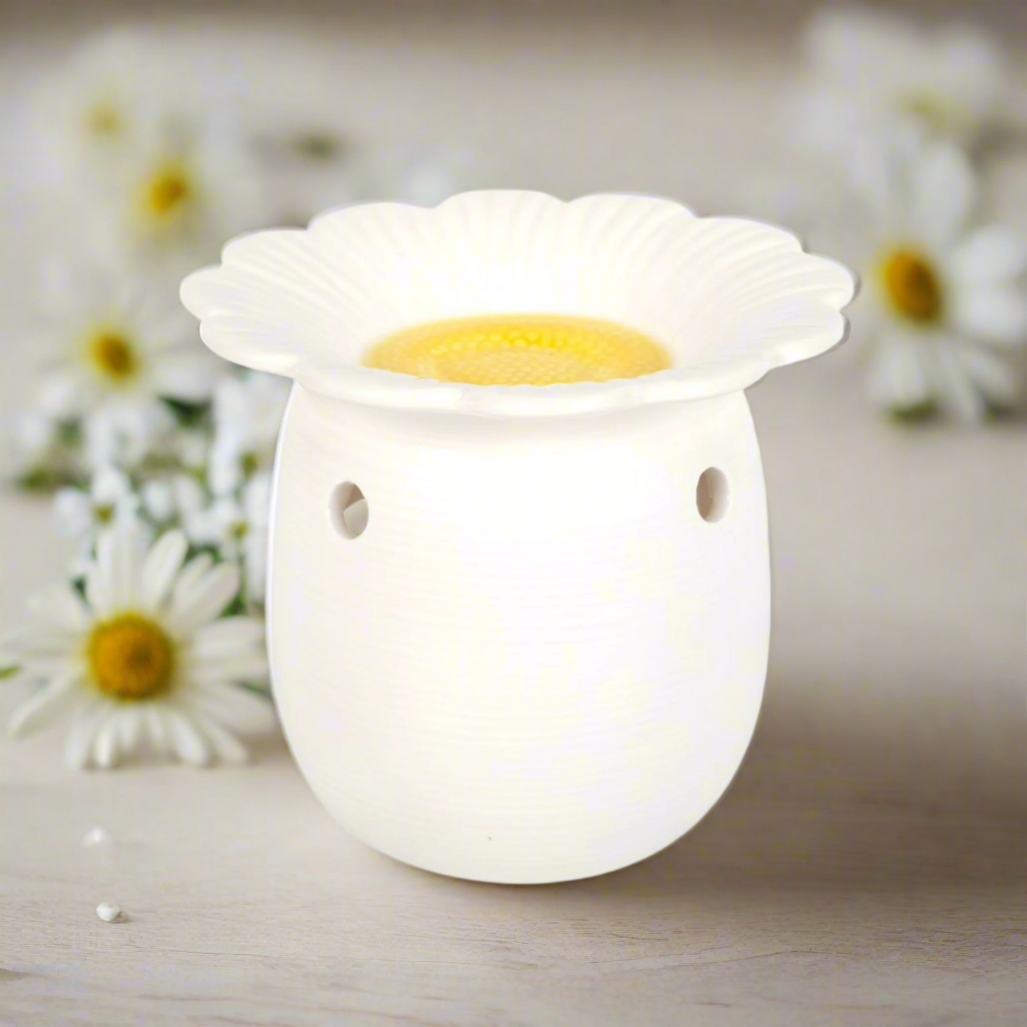 daisy-shaped White Ceramic Wax Melt Burner. Its clean, minimalist design adds a touch of understated elegance to any space. 