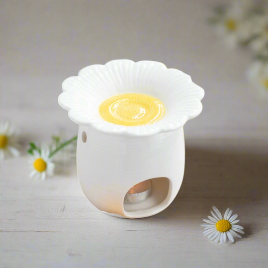 daisy-shaped White Ceramic Wax Melt Burner. Its clean, minimalist design adds a touch of understated elegance to any space. 