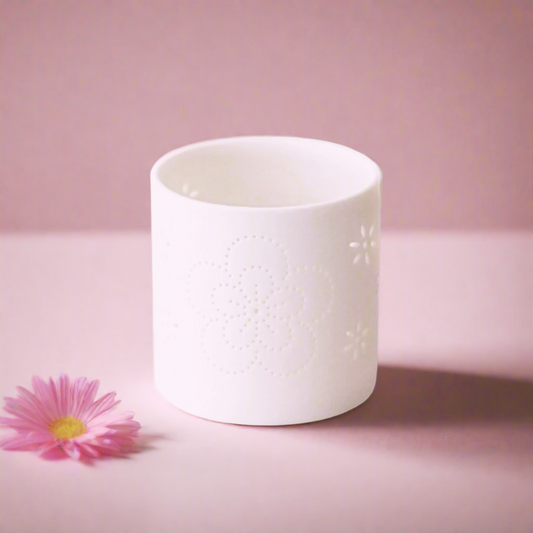 White Tealight Holder. With a pretty floral dot detail pattern, 