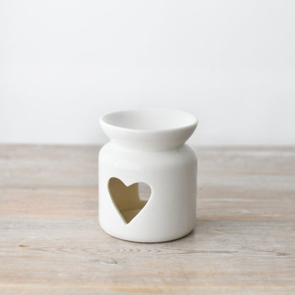 White ceramic oil burner with a heart-shaped cutout 