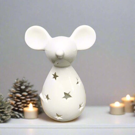 Cute and Simple Mouse Tealight Holder. Add a touch of whimsy to your holiday decor. This adorable mouse-shaped tealight holder, featuring a charming star cut-out decal and a sleek white finish, is the perfect way to bring a touch of festive cheer to your 